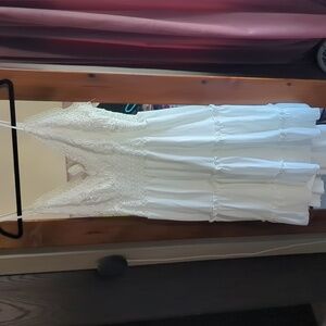 White, crochet top, ruffle bottom, backless dress.